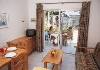 Green Oasis Apartments bedroom photograph