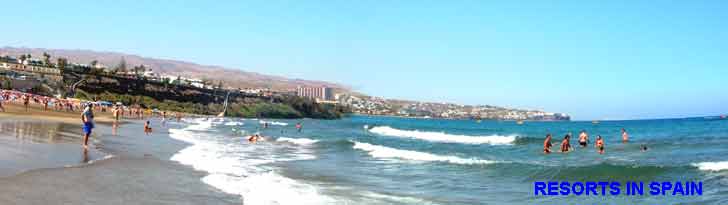 Playa del ingles beach panorama with San Agustin in the distance